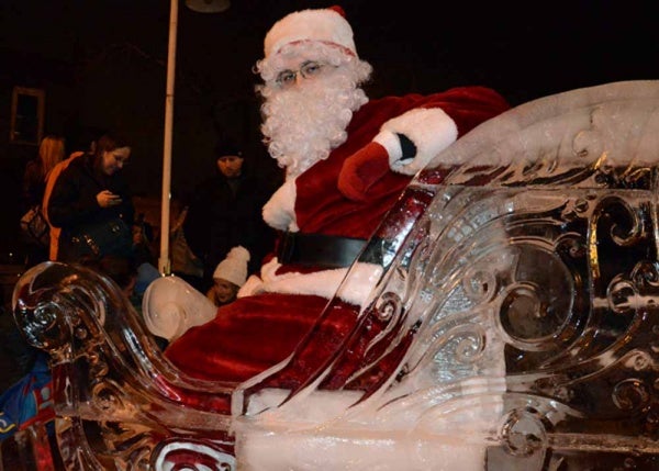 <p><p>Santa posed for pictures on his sleigh with visitors throughout the day on Saturday in Manayunk. (Jimmy Viola/for NewsWorks)</p></p>
