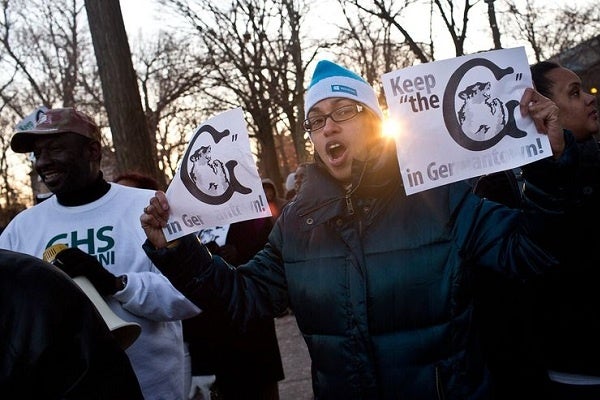 <p><p>"Keep the G in Germantown" signs were distributed. (Kevin Cook/for NewsWorks)</p></p>
