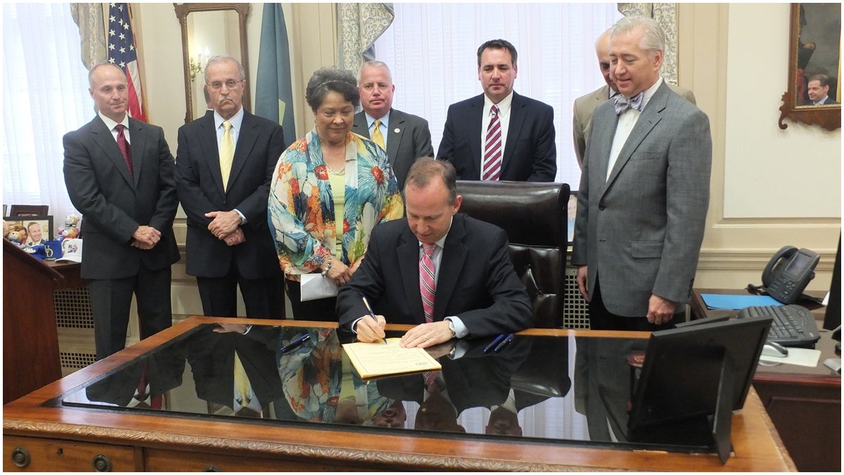  Gov.Jack Markell, D-Del., joined by Sen. Margaret Rose Henry, D-Wilm. East, and Rep. Michael Barbieri, D-Newark during the signing of Senate Bill 16.  