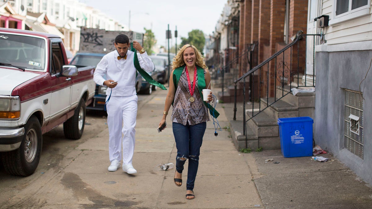  Walking down her block, Savannah beams with pride on graduation day. (Jessica Kourkounis/For Keystone Crossroads) 