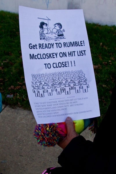 <p><p>The grandmother of two McCloskey students holds a flyer given out by a concerned parent after the end of school hours Thursday. (Brad Larrison/for NewsWorks)</p></p>
