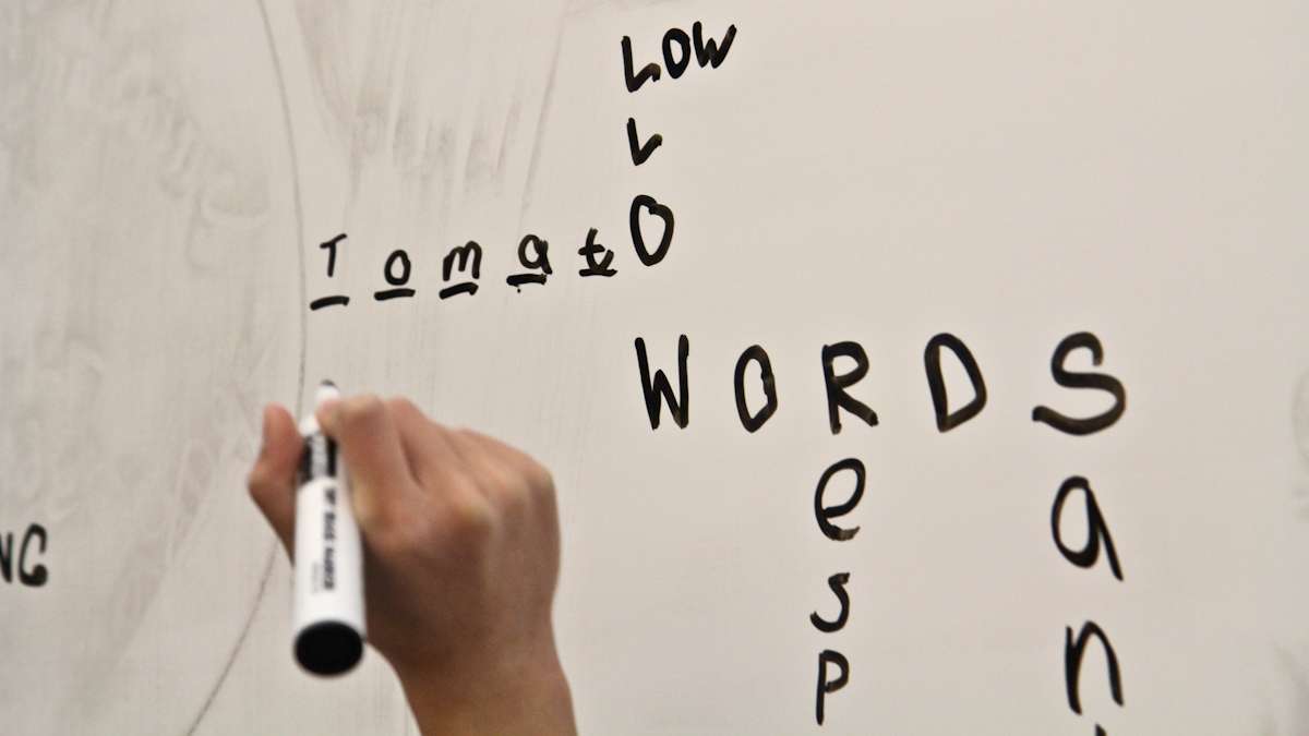 Second graders are taught to play Scrabble at school district headquarters Wednesday. (Kimberly Paynter/WHYY)