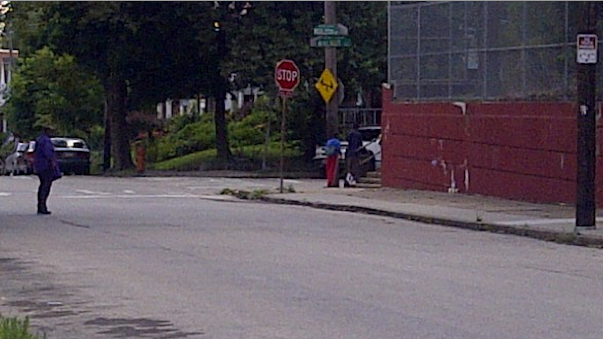  Youths turn the corner near Simons Recreation Center in West Oak Lane, where fellow teens shared their thoughts on the Zimmerman verdict. (Brian Hickey/WHYY) 