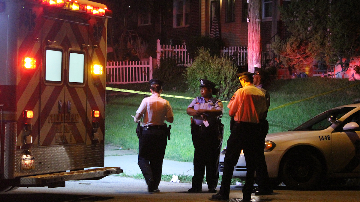  Police on the scene of Monday night's double shooting in Cedarbrook. (Matthew Grady/for NewsWorks) 