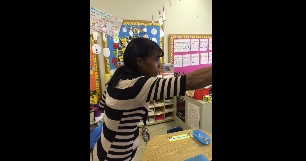  Val Spivey talks to kindergarteners at play. (Carrie Hagen/for NewsWorks) 