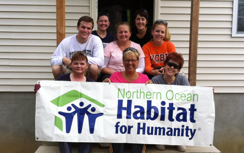  In Aug. 2013, Johnson & Johnson employees helped install insulation in a house under construction. (Photo courtesy of Northern Ocean Habitat for Humanity)  