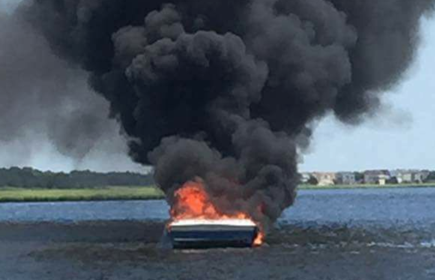  A boat fully engulfed in flames near Mystic Island Monday afternoon. (Image: Dennis C. Seeley Jr. via Mystic Island Volunteer Fire Company on Facebook) 