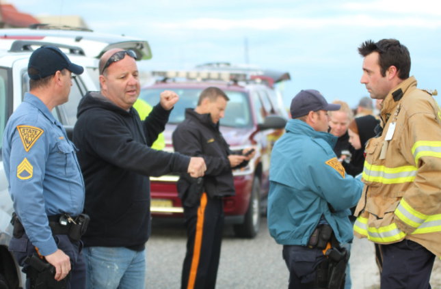  Authorities take a statement from an unidentified eyewitness near the beach in Cape May late this afternoon. (Photo courtesy of John Cooke) 