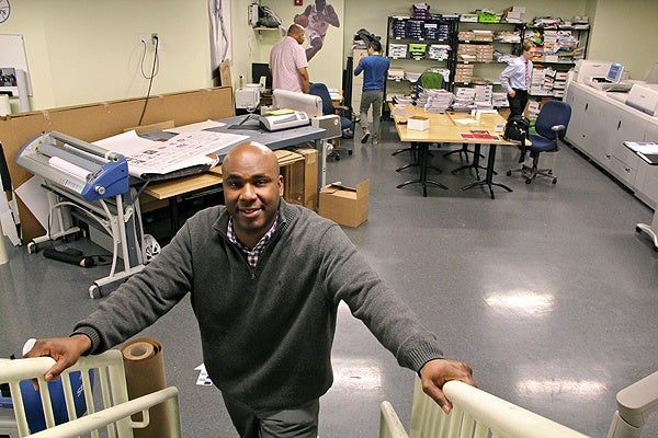 <p>Keith Leaphart employs 11 people at his buusy Center City print shop. (Emma Lee/for NewsWorks)</p>
