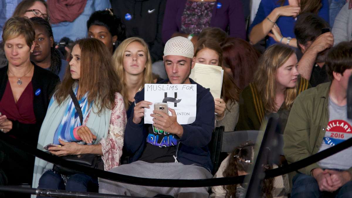 Jonathan Lee Riches (center) is seen in the audience of an Oct. 4, 2016, Family Town Hall event with with Hillary and Chelsea Clinton, in Haverford, Pennsylvania, where he claims to be a Muslim supporter of the Democratic presidential nominee while the same man was seen three days earlier claiming to be a Muslim supporting Trump at a rally in Manheim. (Bastiaan Slabbers for NewsWorks)