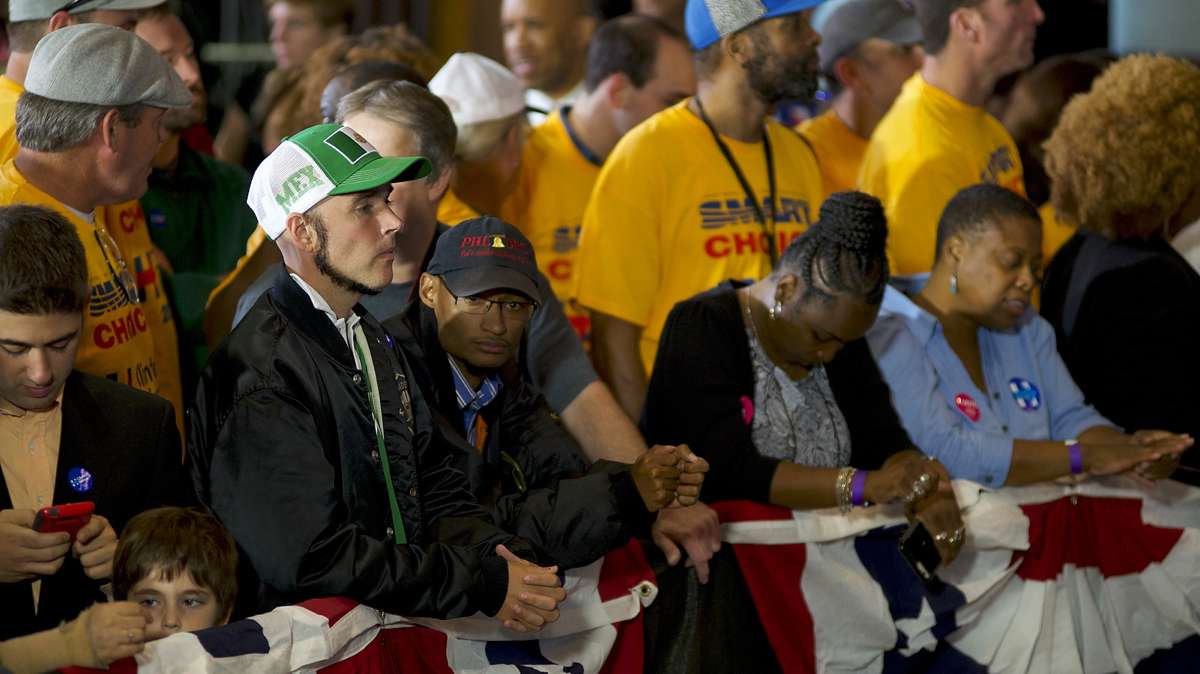 Jonathan Lee Riches is seen in the front row at a rally with Vvce presidential candidate Tim Kaine on Oct. 5, 2016, at Sheet Metal Workers Local Union 19 Hall in Philadelphia. Riches wears a hat and shirt in the national colors of Mexico but he claims not to be Mexican himself but only representing hard working legal Mexicans nationwide. (Bastiaan Slabbers for NewsWorks)