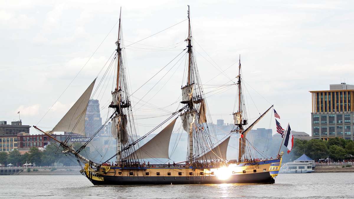 L'Hermione, a replica of the Marquis de Lafayette's 18th century ship fires her cannons as she arrives for the four-day Tall Ships Festival in Camden and Philadelphia. (Emma Lee/WHYY)
