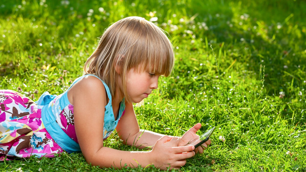  (<a href='http://www.shutterstock.com/pic-221280079/stock-photo-little-girl-usng-a-touch-pad-in-a-summer-garden.html'>Little girl using a tablet computer</a> image courtesy of Shutterstock.com) 