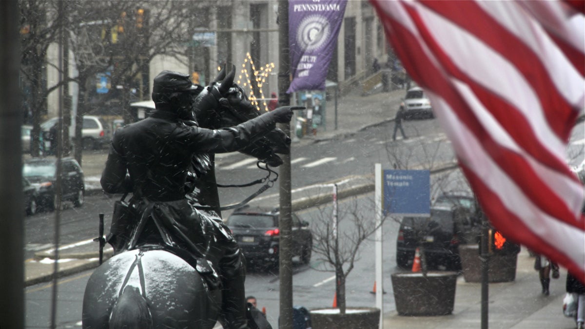 The statie of Major General John Fulton Reynolds and his horse is dusted by snow in front of City Hall as the storm develops. (Emma Lee/WHYY)