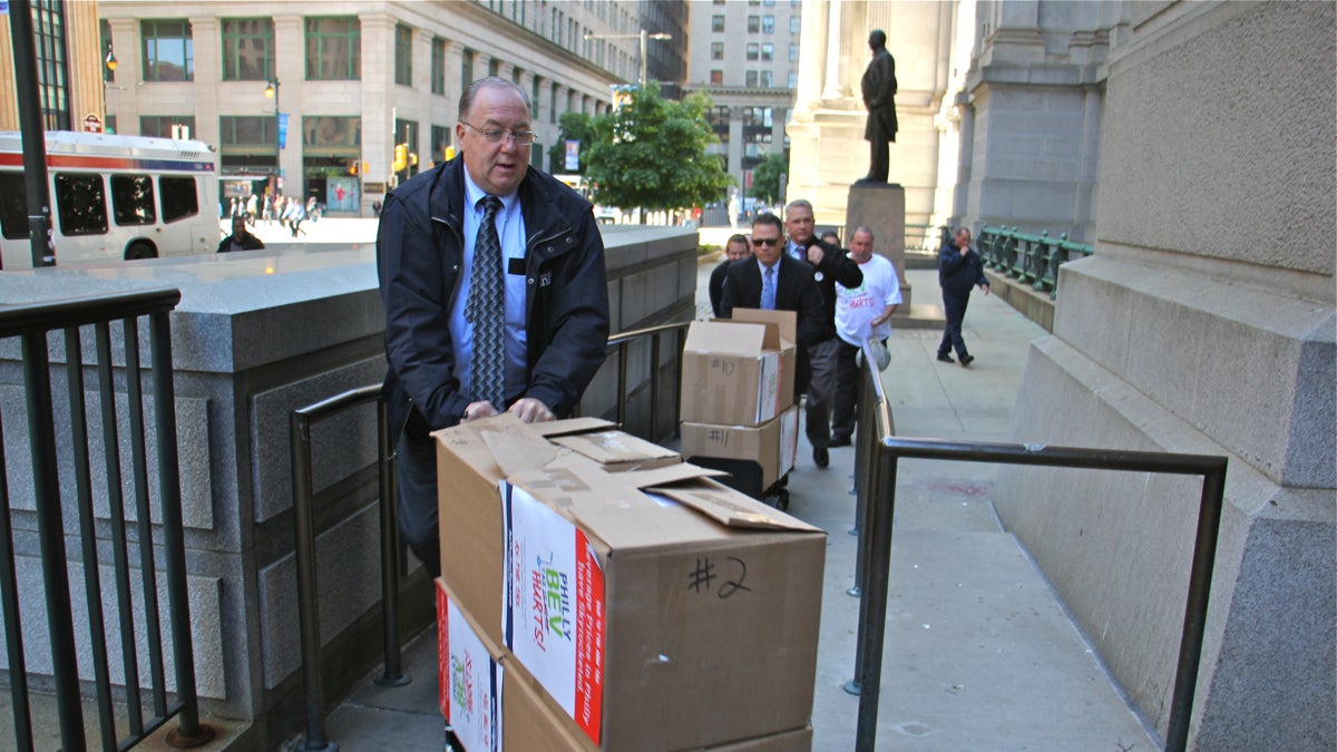  Representatives of Ax the Bev Tax, a coalition opposed to Philadelphia's sweetened beverage tax, deliver boxes of petitions and letters to City Hall. (Emma Lee/WHYY) 