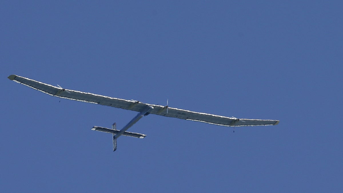  The Solar Impulse, piloted by Bertrand Piccard, flies over San Francisco Bay in April 2013. (AP Photo/Jeff Chiu) 