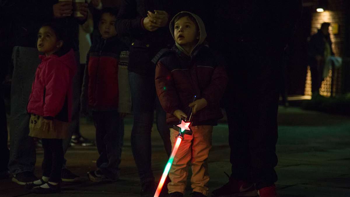 Families gaze upon the first light show of the season at Franklin Square Park during its annual holiday festival, running November 10 through December 31.