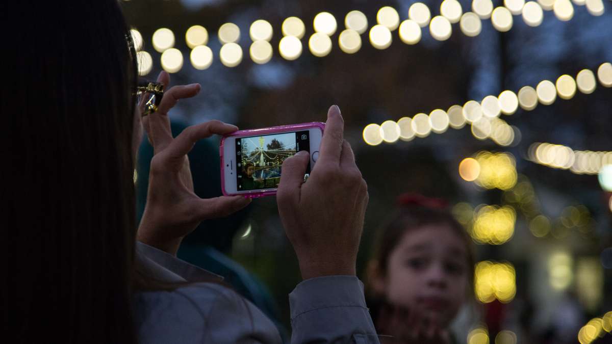 Families gaze upon the first light show of the season at Franklin Square Park during its annual holiday festival, running November 10 through December 31.