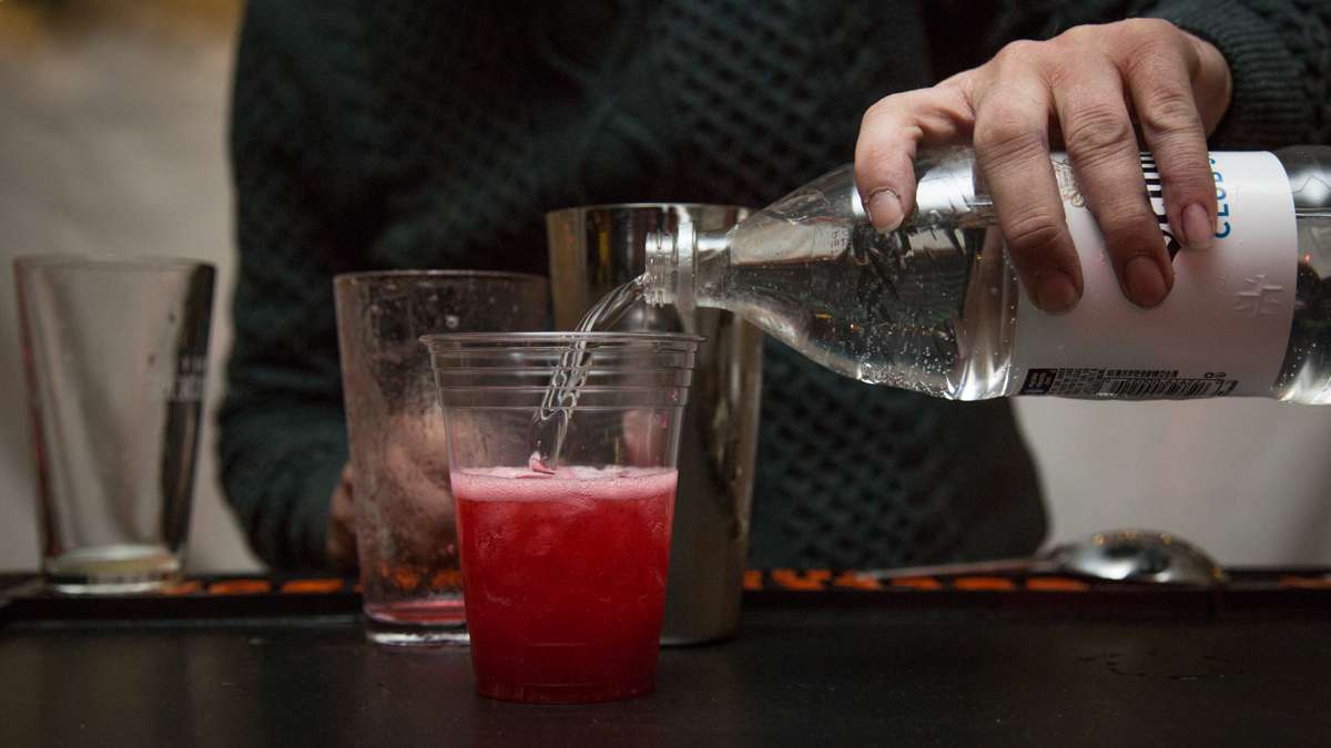 The night's signiture cocktail, a cranberry fizz, is poured at the beer garden inside The Franklin Square Holiday and Light Festival tent. The festival runs November 10 through December 31 and is free to the public.