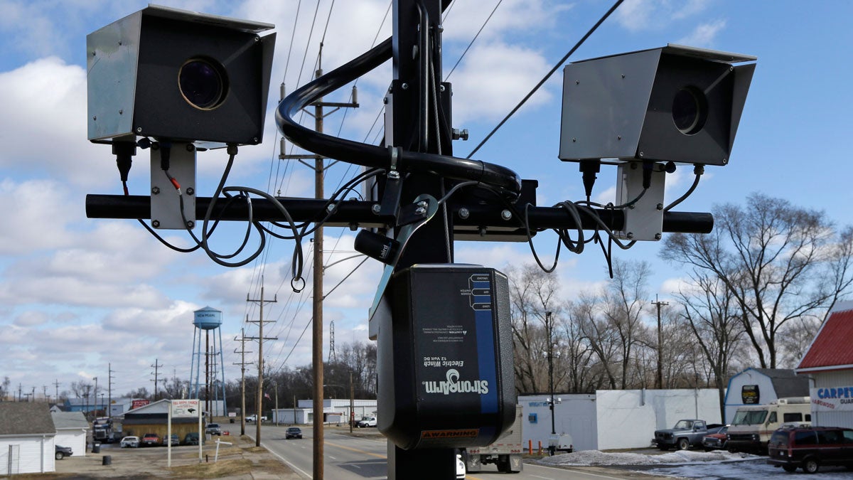  This Tuesday, Feb. 25, 2014 file photo shows speed cameras aimed at U.S. Route 127, in New Miami, Ohio. (AP Photo/Al Behrman, File) 