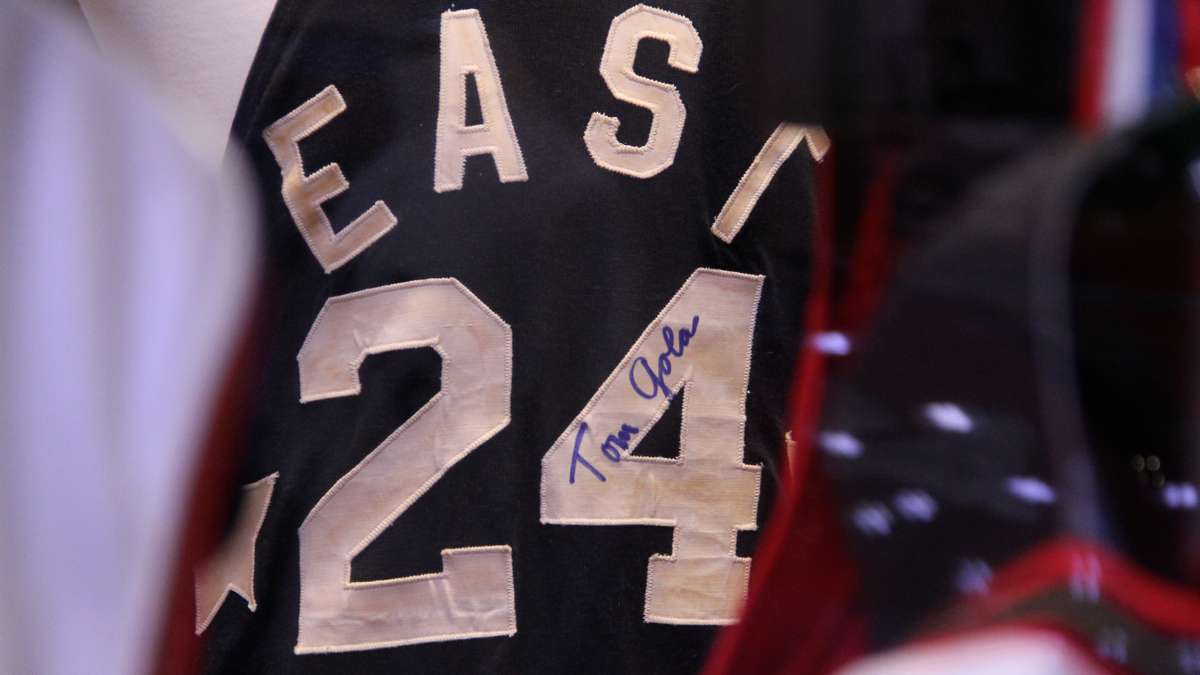 Tucked among an impressive collection of game-worn basketball jerseys is the autographed all-star jersey of LaSalle College's Tom Gola. (Emma Lee/WHYY)