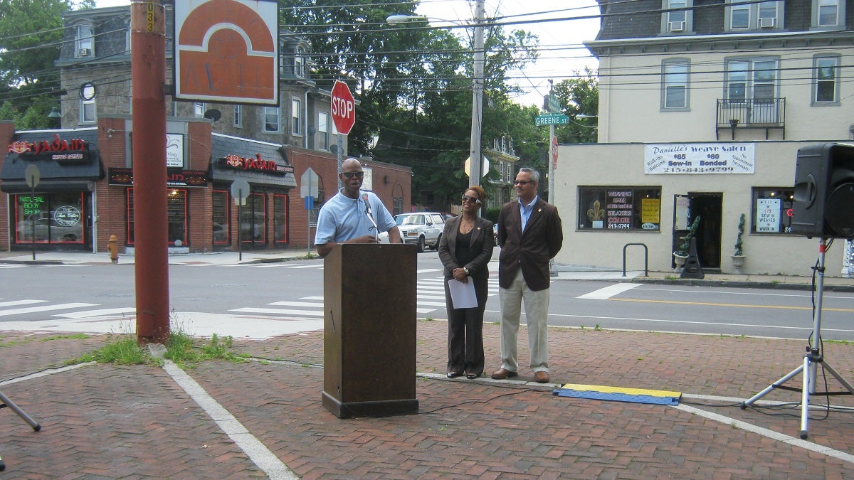  Eighth District City Councilwoman Cindy Bass (center) was joined by state Rep. Stephen Kinsey (at podium) and Kevin Dow of the city's Commerce Department at Saturday's announcement on Maplewood Mall. (Alaina Mabaso/for NewsWorks) 