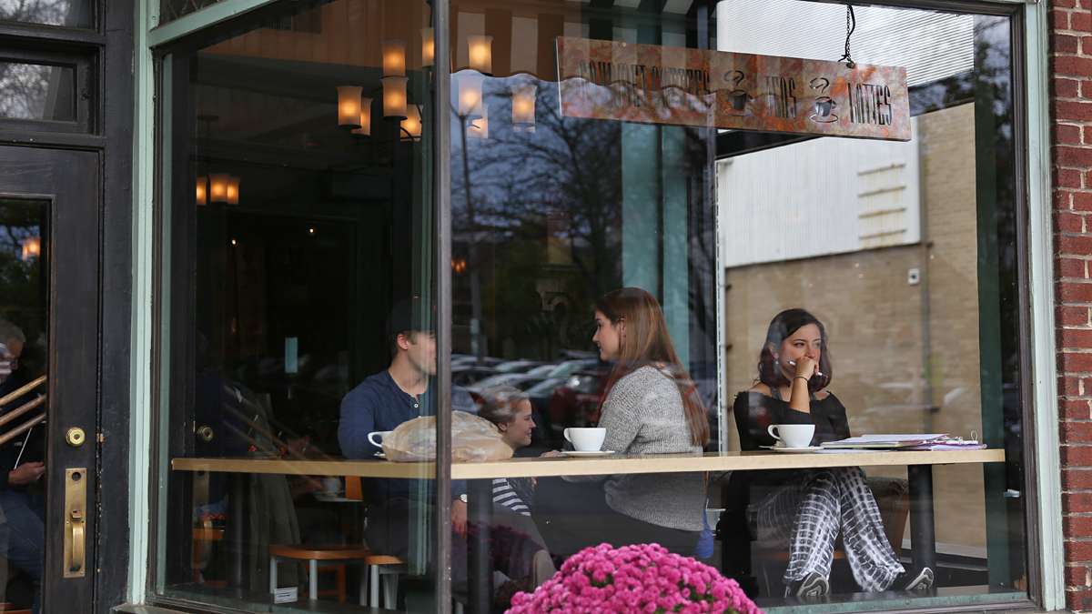 Natalie DeSisto, a junior from Pittsburgh, studies general science at Saint’s Cafe on Beaver Avenue in downtown State College. (Lindsay Lazarski/WHYY)