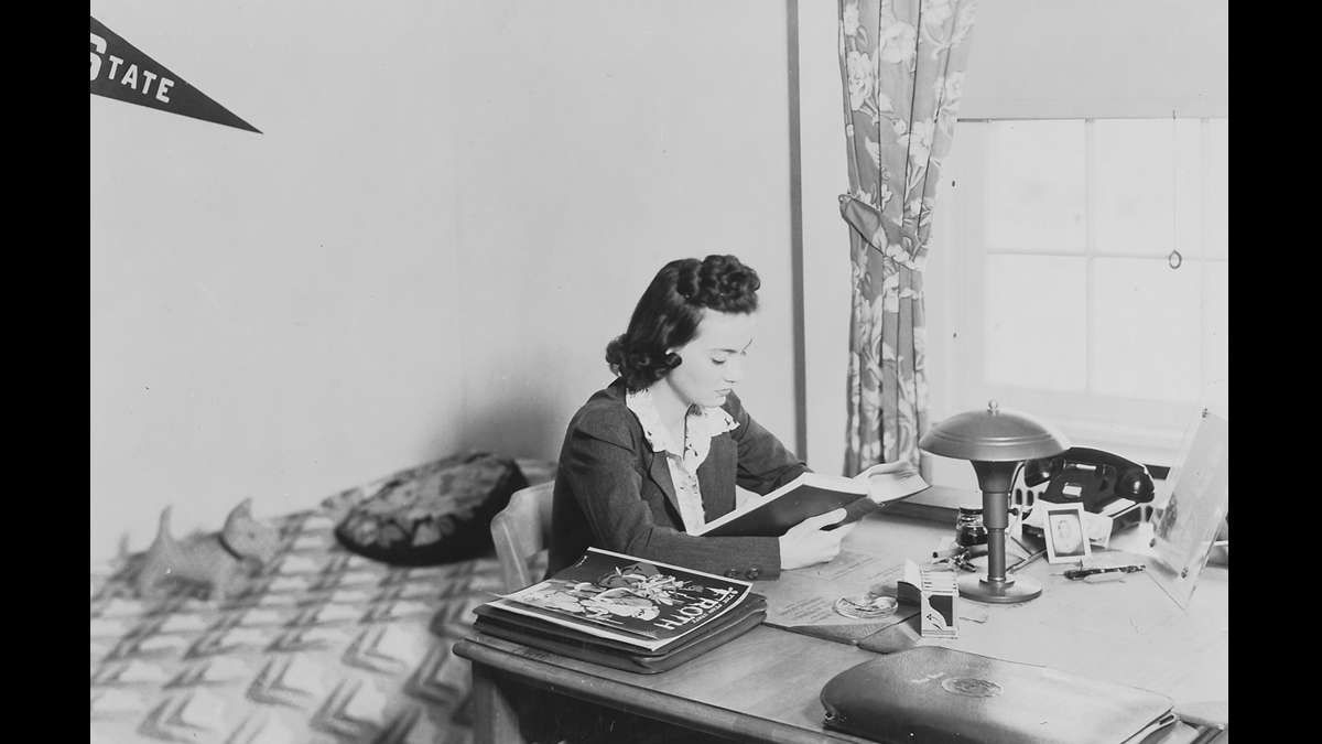 An unidentified woman studies at the Grange Memorial Dormitory for Girls — now known as the Grange Building. (Image courtesy of the Centre County Historical Society)