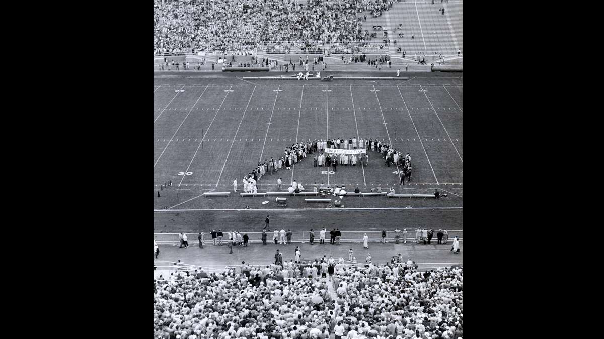 Fans watch a pre-game ceremony honoring the 1909 football team before the first game played at Beaver Stadium in 1960. (Image courtesy of the Centre County Historical Society)