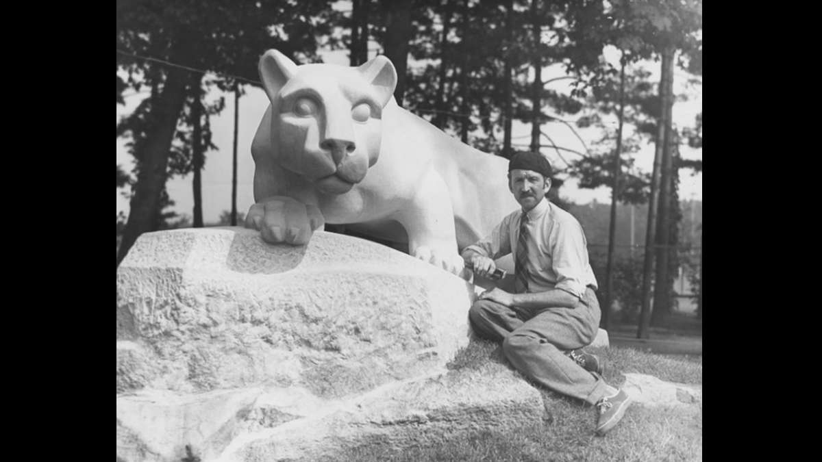 Sculptor Heinz Warneke at the base of the Nittany Lion Shrine. He created the sculpture out of Indiana limestone in 1942. The shrine was a gift from the class of 1940. (Image courtesy of the Penn State University Archives)