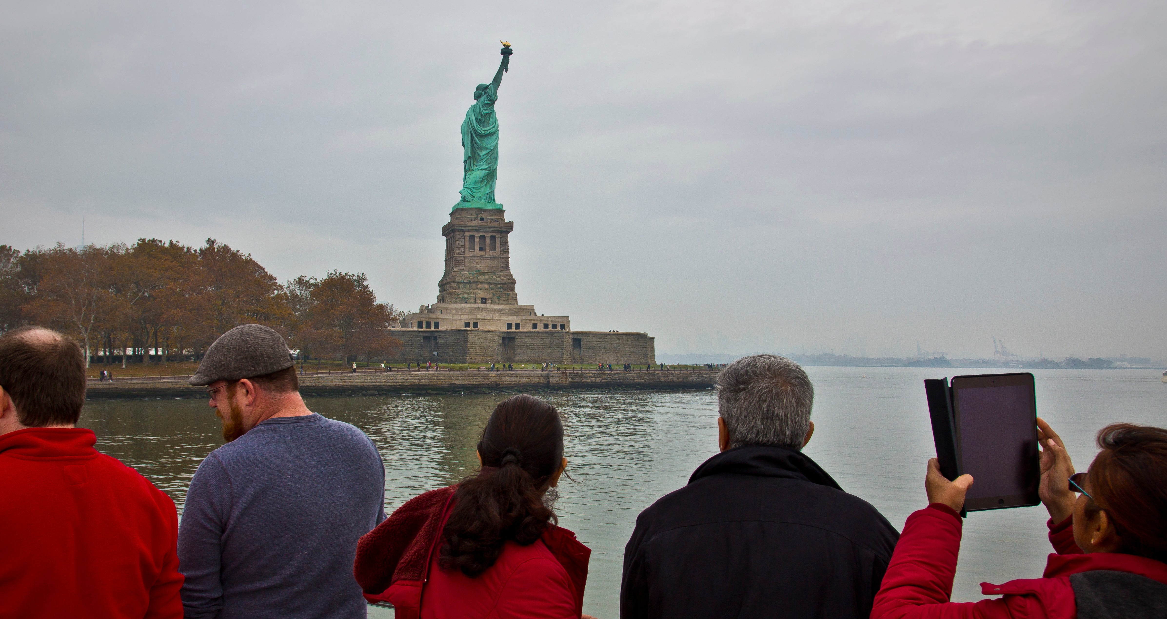  Visitors view the Statue of Liberty during a ferry ride to Liberty Island in New York. (AP Photo/Bebeto Matthews, File) 