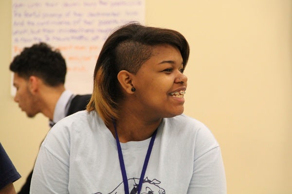 <p>Julissa Valentin, a student in Kathleen Gaynor's acting class at Mariana Bracetti Academy Charter, grins as she reads through her scene with classmates. (Emma Lee/for NewsWorks)</p>
