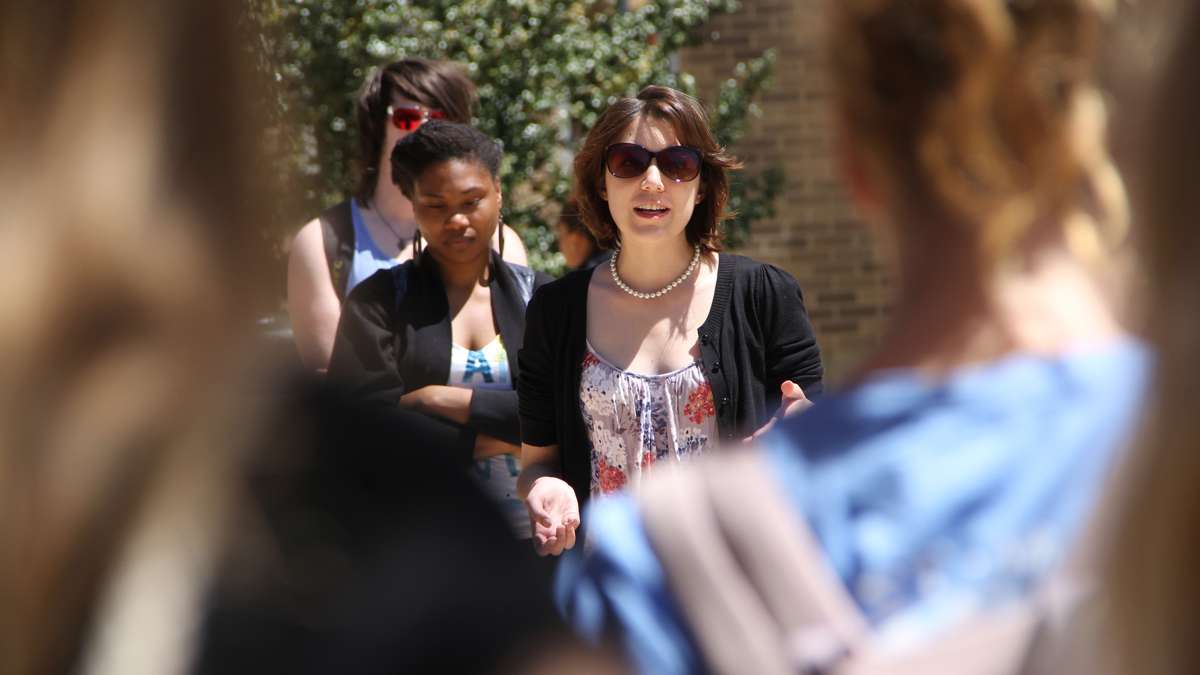 West Chester senior Caitlin O'Connor speaks to fellow students during a rally on the campus quad. A sharp increase in reported sexual assaults on campus prompted the rally. (Emma Lee/for NewsWorks)