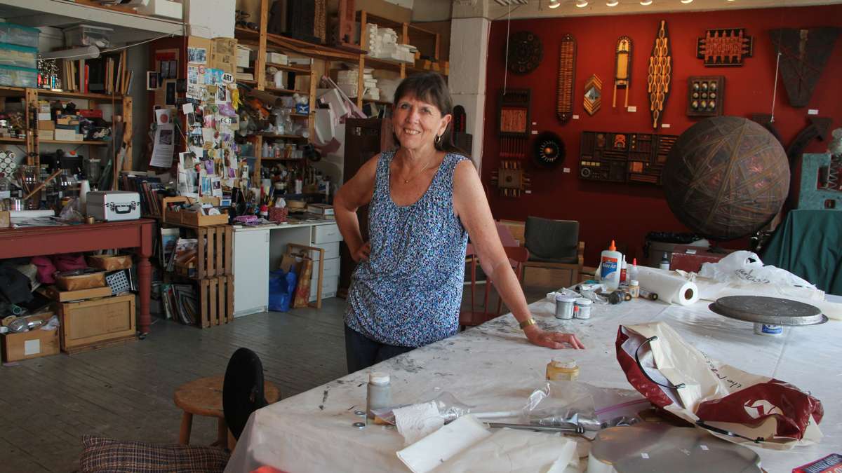 In this 2015 file photo, Carol Cole is comfortably settled into her spacious well-lit studio at 915 Art Building on Spring Garden Street. One of the original artists to occupy the space, she had been there since 1981, and was one of the many artist forced out of the buidling in 2015 due to the fire. (Emma Lee/WHYY)