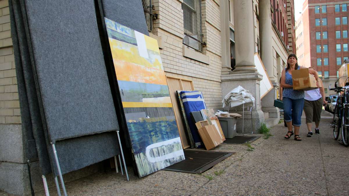 Paintings and art supplies are removed from the studios at 915 Spring Garden Street. The building, which provides studio space to 100 artists, was closed because of fire code violations. (Emma Lee/WHYY)