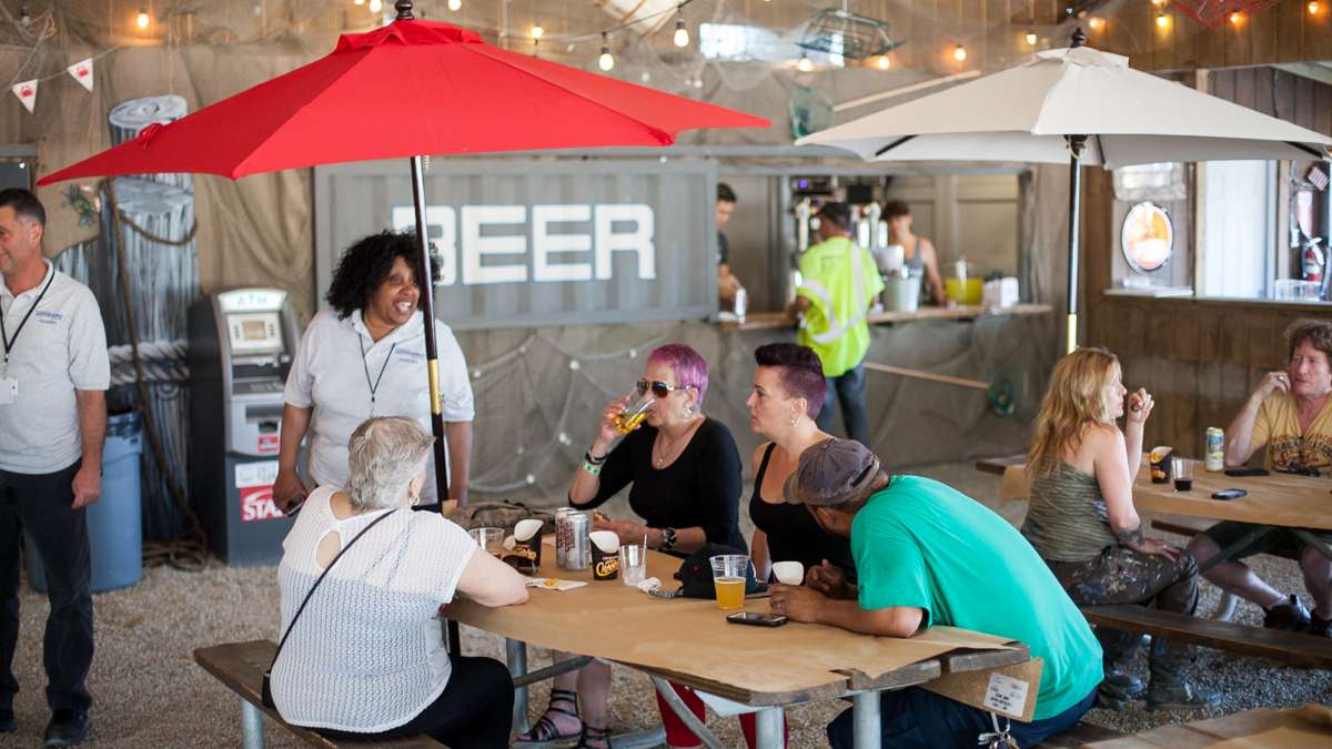 Friends and family of those who work for or had a hand in the construction of the River Rink at Penn's Landing enjoy compliementary drinks and food.