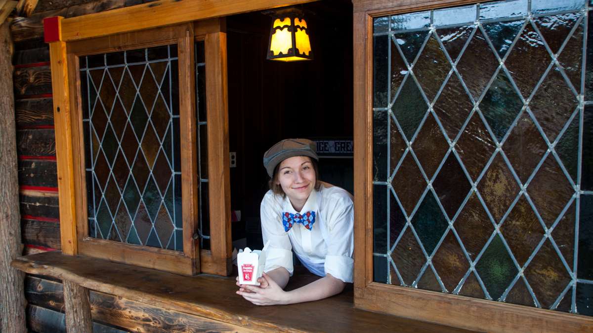 Katie Reynolds serves up ice cream at the Franklin Fountain outpost at the River Rink at Penn's Landing.