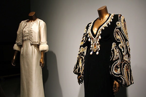 <p>One of the Supremes' most famous dresses is the Black Butterfly, a black velveteen gown featuring voluminous gold brocade bishop sleeves embroidered with gold-work paisleys. (Emma Lee/for NewsWorks)</p>
