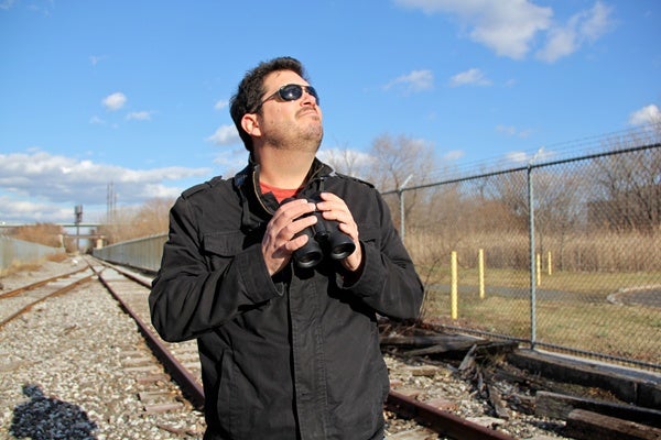 <p>Birder George Armistead uses the railroad tracks that bisect the sewage treatment plant in order to observe the birds that are drawn to it. (Emma Lee/for NewsWorks)</p>
