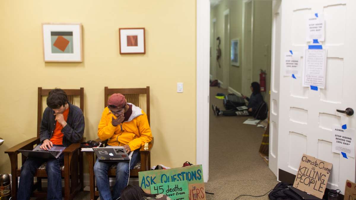 Swarthmore College students gather near the office of the president during day two of a sit-in to call for an end to the college's investment in fossil fuels. (Brad Larrison/WHYY)