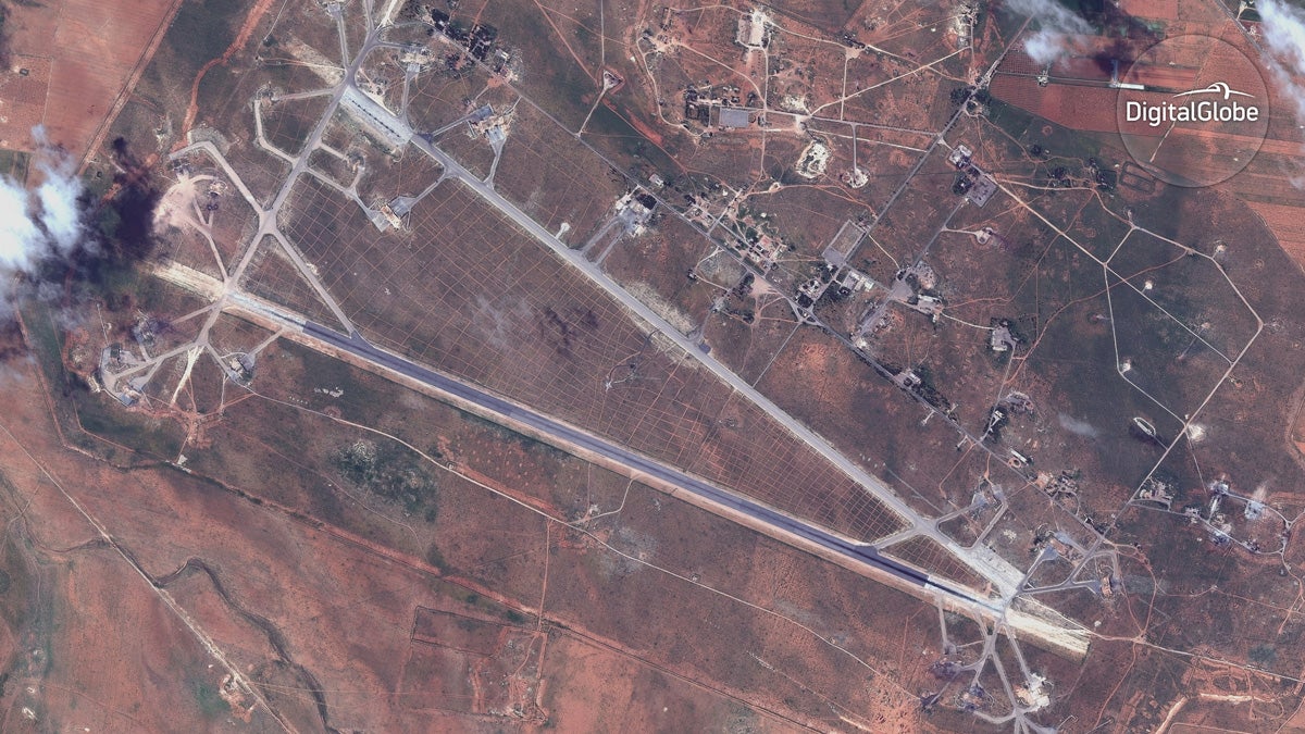  This satellite image provided by DigitalGlobe shows an image captured on April 7 of the Shayrat air base in Syria, following U.S. Tomahawk Land Attack Missile strikes on Friday, April 7, 2017 from the USS Ross (DDG 71) and USS Porter (DDG 78). The United States blasted the air base with a barrage of cruise missiles on Friday, April 7, 2017 in fiery retaliation for this week's gruesome chemical weapons attack against civilians. (DigitalGlobe via AP) 
