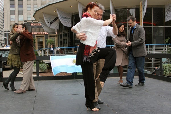 <p>Local devotees of Argentine tango take to the stage in Love Park as Argentine Week continues in Philadelphia. (Emma Lee/for NewsWorks)</p>
