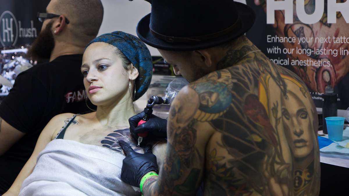Sahara Castillo is tattooed by artist Jon Mesa. (Kimberly Paynter/WHYY)