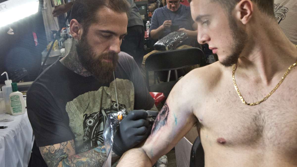 Branden Stiffler receives a wolf tattoo from artist Corey James in honor of his grandmother.