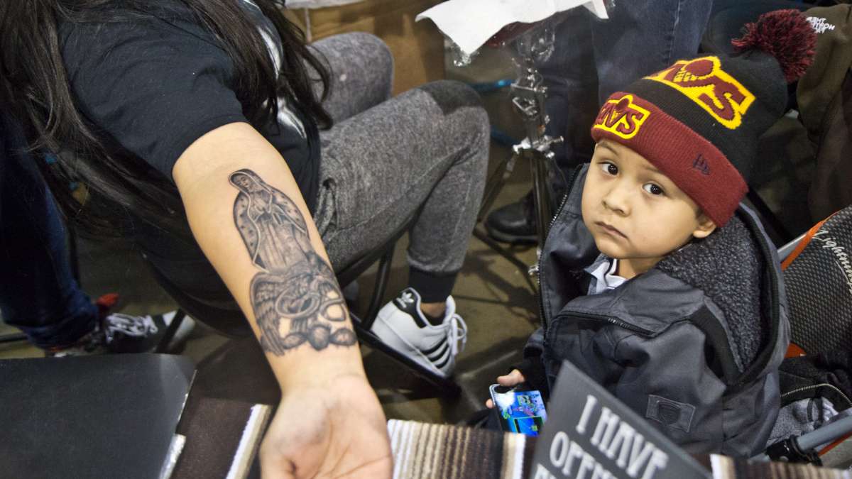 While Marylu Calvario received a tattoo of the Virgin Mary with an eagle to honor her Mexican heritage, her 4-year-old Jonathon kept her company.