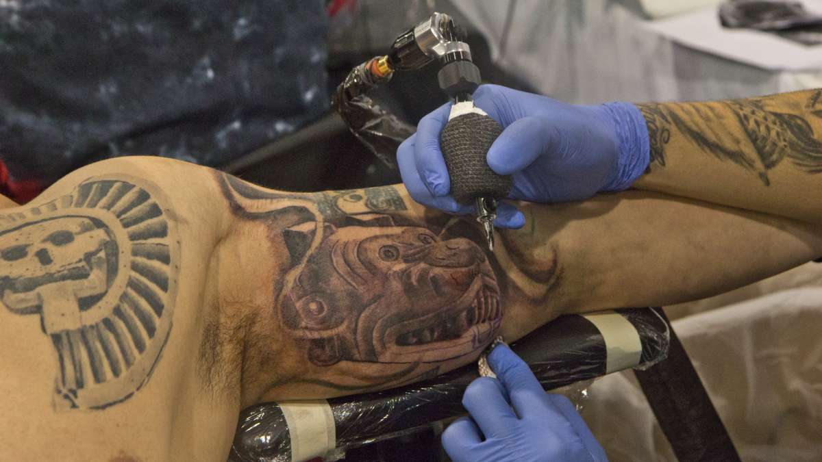 Joe Gonzales gives a nod to his heritage with an Aztec tattoo by artist Burner.