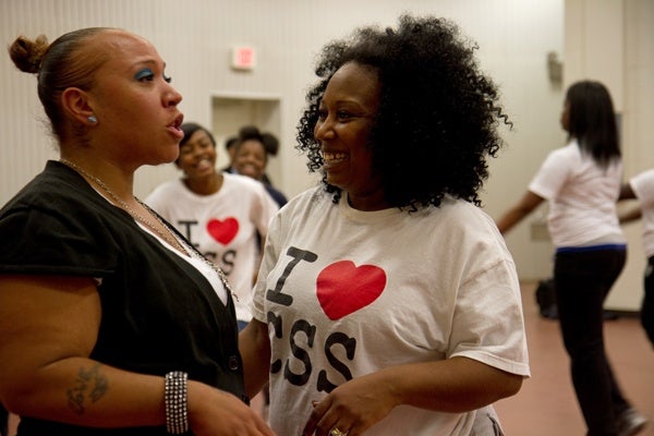 Daniece Matthews, a parent and member of the Camden Sophisticated Sisters, said the drill team is a great way to get exercise. (Lindsay Lazarski/WHYY)
