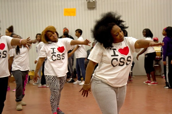 Tawanda Jones leads the Camden Sophisticated Sisters step team through a series of warm-up exercises. (Lindsay Lazarski/WHYY)

