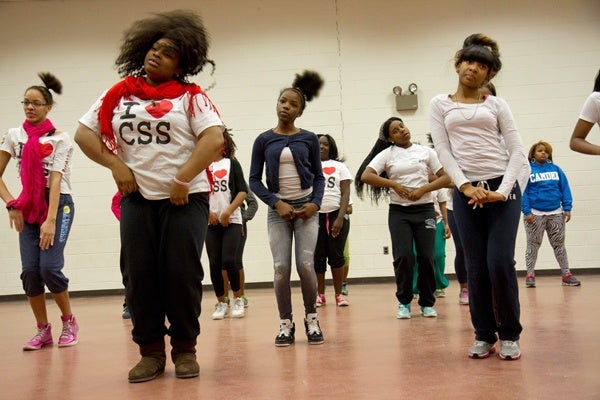 The Camden Sophisticated Sisters practice a dance routine for an upcoming performance called "Love Changes Everything." (Lindsay Lazarski/WHYY)
