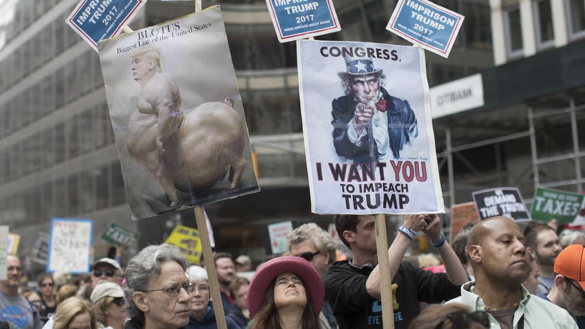  Demonstrators participate in a march and rally to demand President Donald Trump release his tax returns, Saturday, April 15, 2017, in New York. Protesters took to the streets in dozens of cities nationwide Saturday to call on President Donald Trump to release his tax returns, saying Americans deserve to know about his business ties and potential conflicts of interest. (Mary Altaffer/AP Photo) 